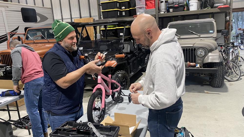Fitting parts on a pink bike